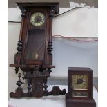 A Vienna regulator type wall clock together with a mantle clock