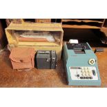 An adding machine together with Biloura camera and a model of the Artemis ***TO BE RE-OFFERED IN A