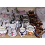 A collection of pottery jugs including Sunderland lustre, copper lustre,