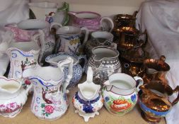 A collection of pottery jugs including Sunderland lustre, copper lustre,