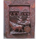 A Balinese carved panel and Balinese painting together with a poke work mirror, watercolour,