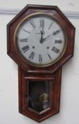 A Victorian walnut drop dial wall clock, of octagonal form with a glazed door and pointed base,