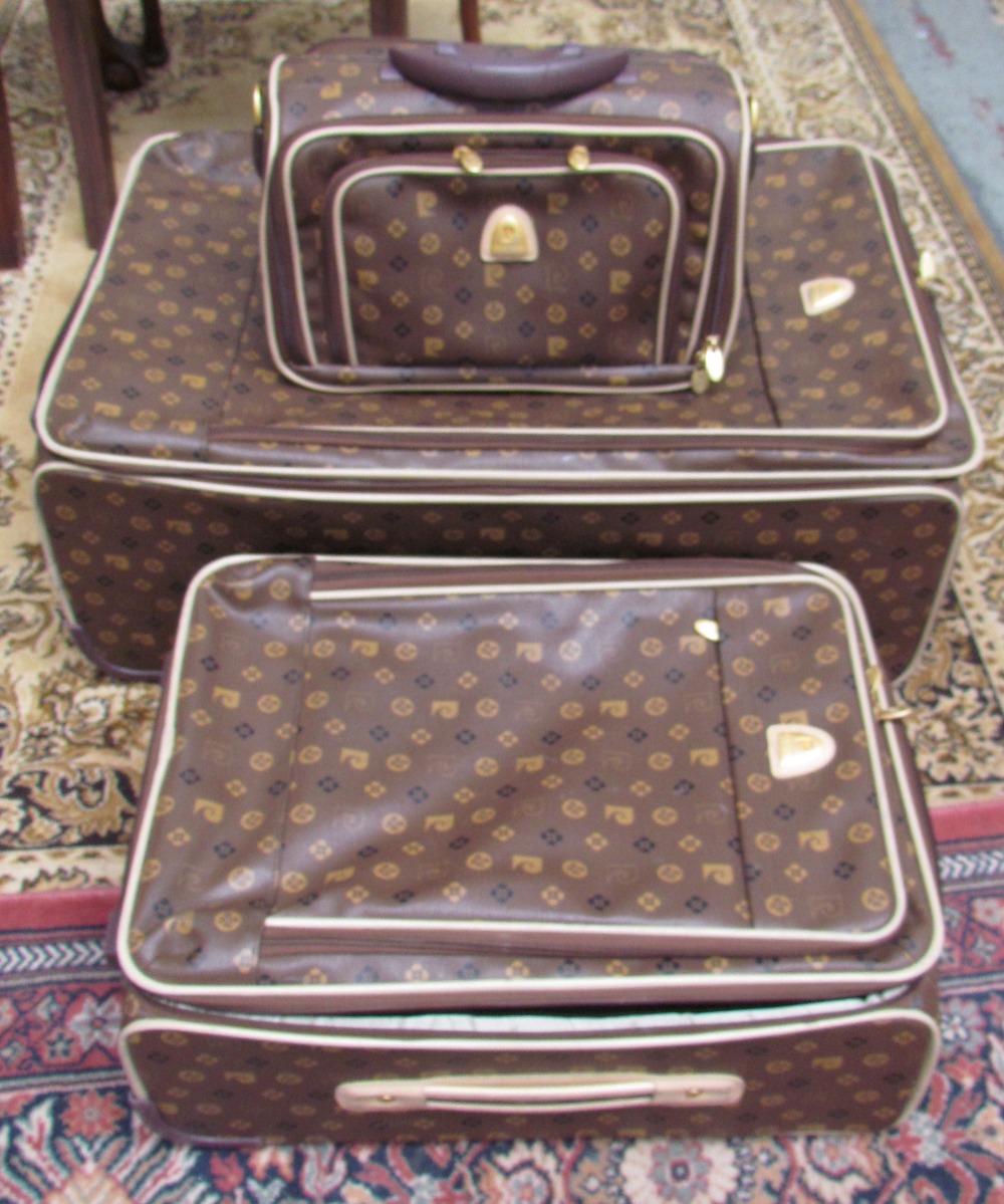 Three Pierre Cardin cases including a suitcase,