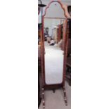 A 20th century walnut framed cheval mirror with a domed top on arched legs