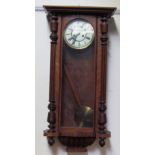 A Vienna regulator type wall clock, with a walnut case,