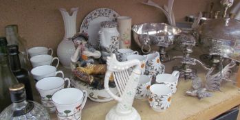 A Belleek harp and vase together with a pottery figure, Coalport Hunting Scenes mugs, glass bottles,