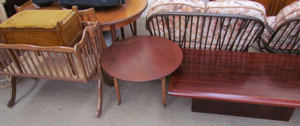 A rectangular rosewood coffee table together with a circular coffee table,