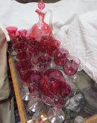 A ruby flash glass ewer together with matching drinking glasses,