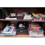 Assorted Elvis memorabilia including annuals, puzzles, CD's, DVD's,