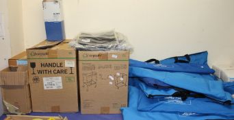 A large lot of medical equipment including Sharps bins, Air filters, fluid shields,