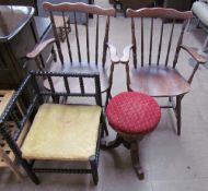 A pair of spindle backed elbow chairs together with an ebonised bobbin turned corner chair and a