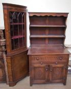 A 20th century oak dresser with a panelled back, the base with a drawer,