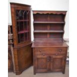 A 20th century oak dresser with a panelled back, the base with a drawer,