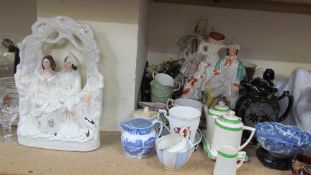 A Staffordshire flatback figure together with other Staffordshire figures, pottery jugs,