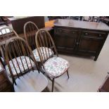 A set of four Ercol dining chairs together with a gateleg dining table, a sideboard,