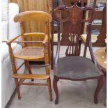 An Edwardian child's high chair with a caned seat on ring turned legs together with an Edwardian