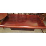 A rectangular rosewood coffee table together with a circular coffee table,