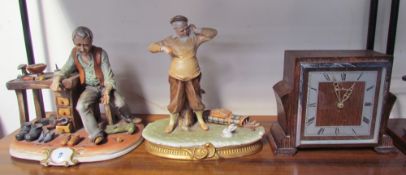 A Capodimonte figure “The Shoemaker” together with another of golfer a mantle clock and a warming