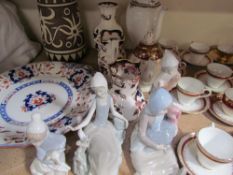 Four Lladro figures together with Masons pottery jugs,