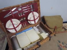 The Brexton Collection picnic basket with pottery and plastic fittings together with a fishing