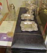 A pair of silver pedestal dishes with a pierced body together with cased carving sets,