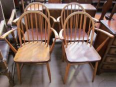 A set of four utility furniture elbow chairs