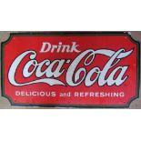 A Coca-Cola enamel sign together with assorted prints