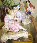 A Vienna style figure group of a loving couple with a caged bird together with a Sitzendorf figure