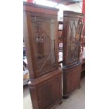 A 20th century walnut standing corner cupboard together with a mahogany standing corner cupboard