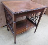 An Edwardian mahogany side table with a cross banded rectangular top on four tapering square legs