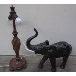 A pottery elephant together with a turned oak table lamp