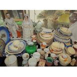 A Staffordshire figure of Queen Victoria and the Prince of Wales together with plates,