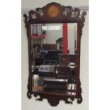 A George III style mahogany wall mirror with an inlaid fan roundel