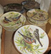 An assortment of limited edition collectors plates