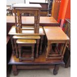 An oak coffee table together with three nests of tables