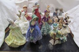 A Royal Doulton figure Miss Demure, together with other figures including Anne Boleyn, Antoinette,