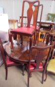 A Victorian mahogany supper table together with a set of six Queen Anne style dining chairs