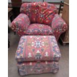 An upholstered armchair and foot stool