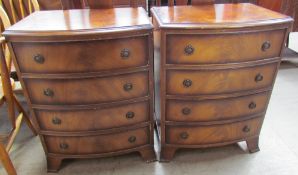 A pair of reproduction mahogany chests each with four graduated drawers on splayed bracket feet