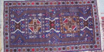 Two Tibetan rugs, one with opposing vases of flowers,