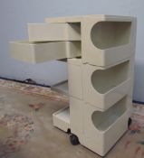 A Joe Columbo Boby trolley in cream standing on castors and having twist out drawers,