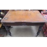 A Victorian mahogany table with a rectangular top and two drawers on turned legs