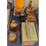 Bottles of Dimple whisky together with Bells decanters etc