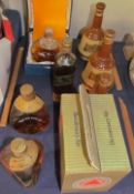 Bottles of Dimple whisky together with Bells decanters etc