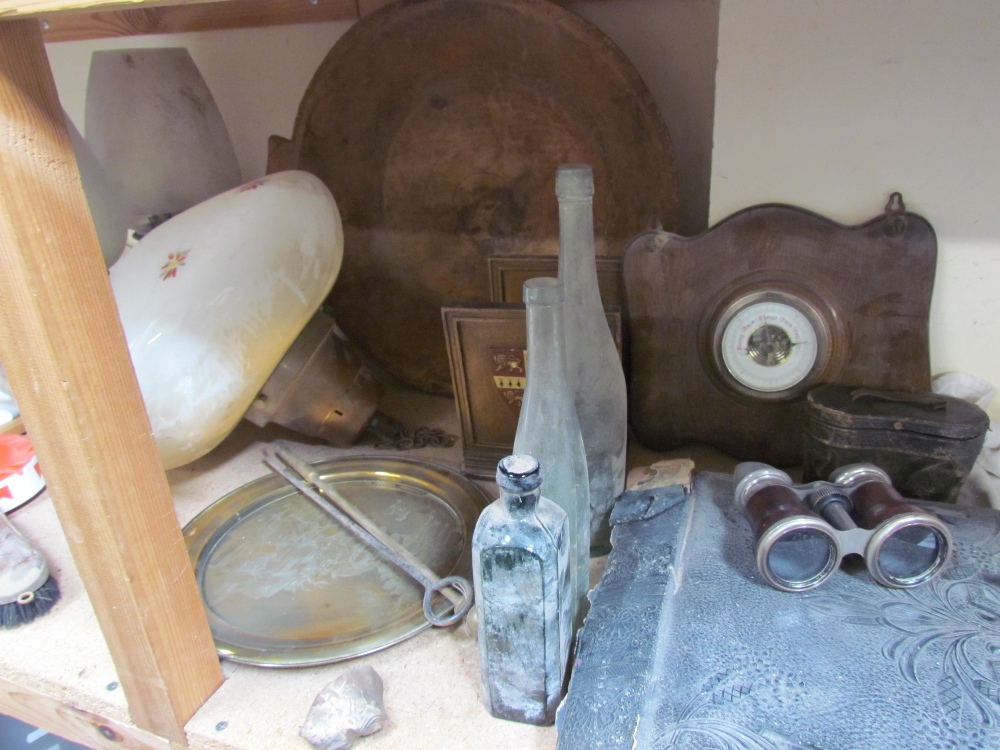 A photograph album together with a pair of binoculars, barometer, glass bottles, treen bowl,