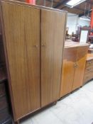 A modern two door wardrobe together with a walnut tallboy