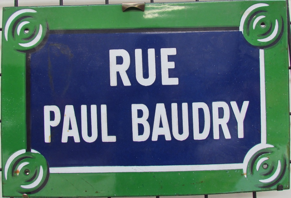 An enamel sign for Rue Paul Baudry together with an Alice in Wonderland plaque and assorted prints,