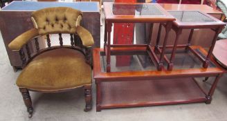 An Edwardian horseshoe shaped elbow chair with spindle back and a stuffer seat on turned legs and