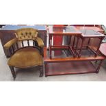 An Edwardian horseshoe shaped elbow chair with spindle back and a stuffer seat on turned legs and