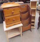 A waterfall bookcase together with a pine bedside cabinet,